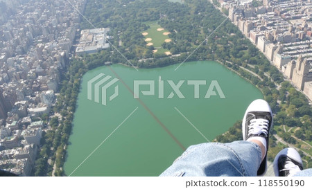 New York City doors off helicopter flight, Manhattan USA. Feet in sneakers, legs in shoes selfie pov 118550190