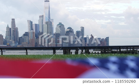 New York City waterfront skyline, Manhattan Downtown World Trade Center cityscape. American USA flag 118550260