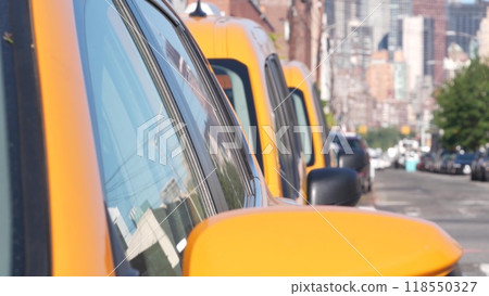 New York City. Row of yellow Taxi cars on street, Queens. Taxi cabs, Long Island. Medallion taxicab. New York City. Row of yellow Taxi cars on street, Queens. Taxi cabs, Long Island. Medallion taxicab. 118550327