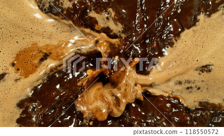 Freeze Motion Detail Shot of Coffee Foam Swirling , Top Down View . 118550572