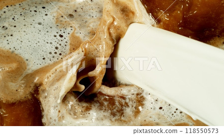 Freeze Motion Detail Shot of Coffee Foam Swirling , Top Down View . 118550573