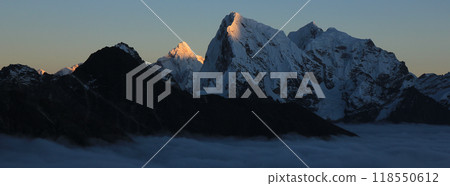 Sun lit peaks of Ama Dablam and Cholatse at sunset, Nepal. 118550612