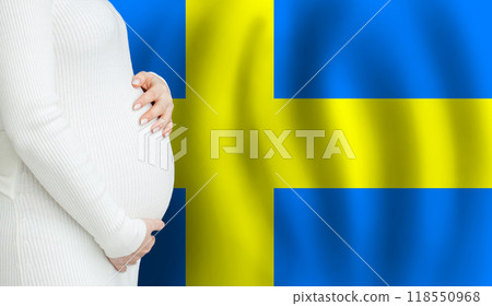 Swedish pregnant woman belly against Swedish flag background. Demographics and pregnancy  118550968