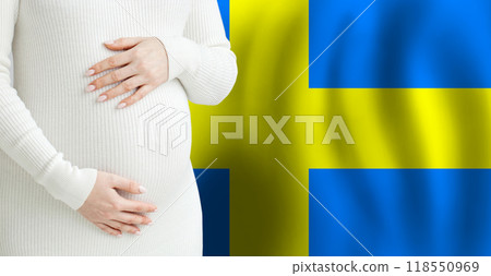 Pregnant woman belly against Swedish flag background. Demographics and pregnancy in Sweden concept 118550969