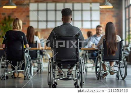 A person in a wheelchair participating in a team meeting 118551433