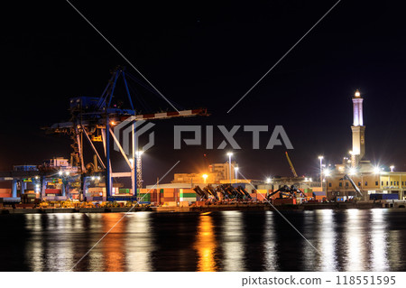 View of Lanterna (lighthouse) in the old port of the city of Genoa at night, Italy 118551595