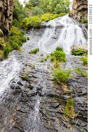 water flow in Jermuk Waterfall in rain 118556013