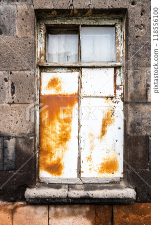 window in old house is covered with rusty tin window in old house is covered with rusty tin 118556100