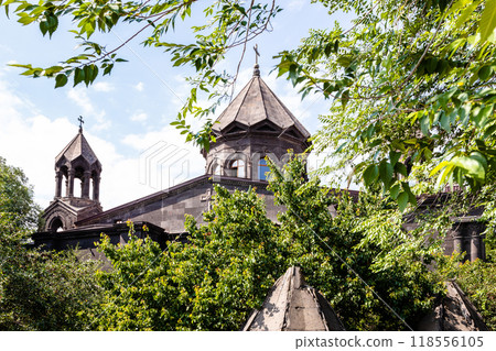 Cathedral between green leaves in Gyumri city 118556105