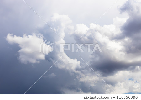 gray rainy storm clouds in blue sky 118556396