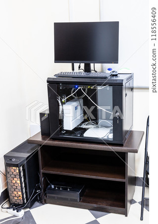 stand with server, router, computer monitor 118556409