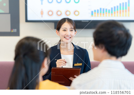Young woman at the reception desk. Photo courtesy of Denpa Gakuen, Tokyo Electronics College. 118556701