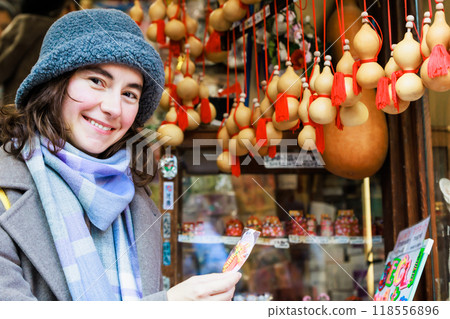 Foreign travelers buying souvenirs while sightseeing in Kyoto 118556896