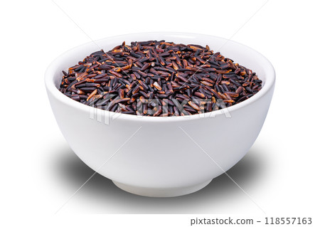 Closeup view of raw riceberry, rice berry seeds in white ceramic bowl. Closeup view of raw riceberry, rice berry seeds in white ceramic bowl. 118557163