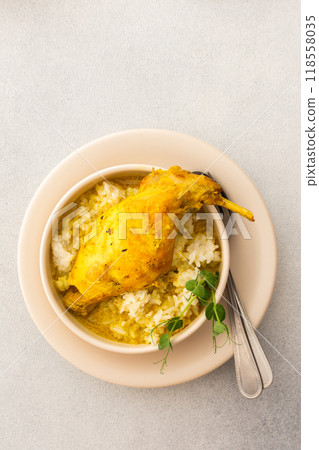 Stewed rabbit with rice, served table with food 118558035