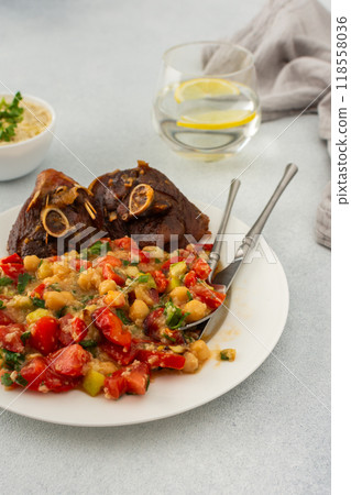 Chickpea stew with stewed vegetables, roasted turkey and hummus 118558036