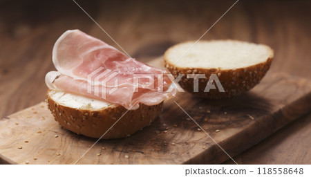 sandwich with prosciutto and cream cheese on wood board sandwich with prosciutto and cream cheese on wood board 118558648