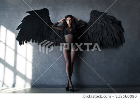 Fallen black angel with wings. 118560080