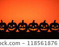 eerie jack-o'-lanterns with glowing faces against a fiery orange background, depicting a classic Halloween scene 118561876