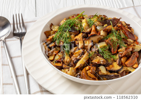 fried blend of wild mushrooms in a bowl 118562310
