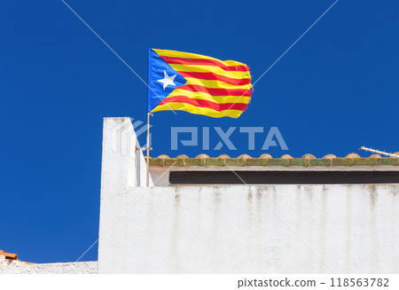 Catalan Independence Flag waving on a Rooftop in Spain 118563782