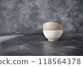 Three ceramic bowls isolated on gray background 118564378