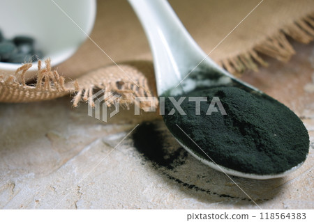 a spoonful of green seaweed powder, pills and capsules a spoonful of green seaweed powder, pills and capsules 118564383