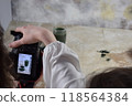 Two young girls photographing in a professional studio 118564384