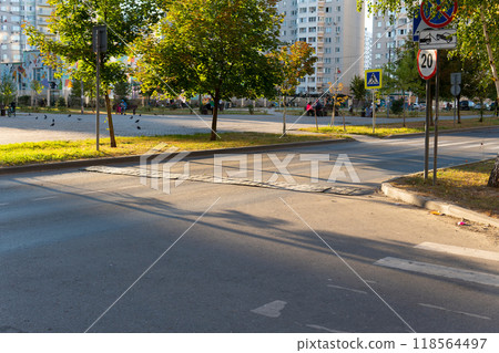 street striped symbol asphalt hump transportation sign barrier road speed texture traffic 118564497