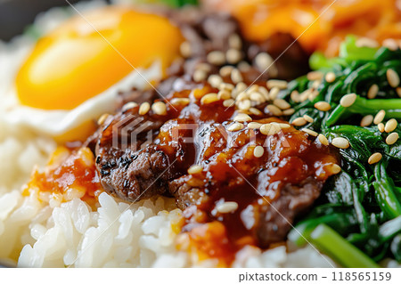 Close up of hot Korean bibimbap with rice, vegetables, and egg Close up of hot Korean bibimbap with rice, vegetables, and egg 118565159