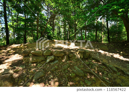 View of the enclosure and remaining stone walls of Yamazaki Castle, the turning point of Mount Tenno 118567422