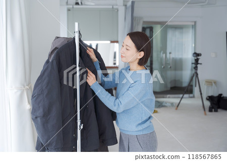 Stylist choosing outfit 118567865