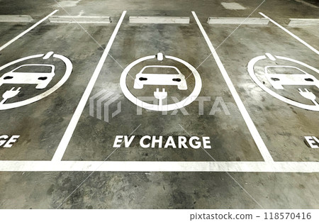 Empty space of EV charge parking lots in a business building, sign of EV charge on the ground of parking lots. 118570416