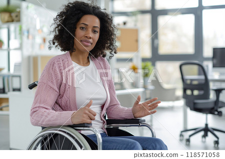 Inclusive office environment with disabled woman in wheelchair, promoting accessibility and diversity Inclusive office environment with disabled woman in wheelchair, promoting accessibility and diversity 118571058