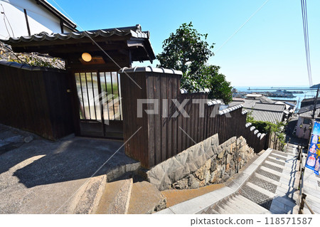Stone walls and a view of Tomo Castle in Bingo Province, overlooking Tomonoura Stone walls and a view of Tomo Castle in Bingo Province, overlooking Tomonoura 118571587