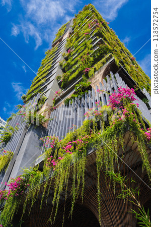 facade of modern green ecology residential building of a skyscraper with landscaping and hanging gardens in Asia 118572754