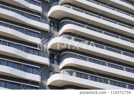 design of facade of a modern hotel skyscraper with balconies 118572756