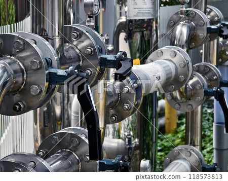 A collection of pipes is interconnected with each other 118573813