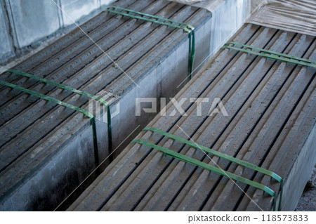 A large stack of concrete slabs on a construction site 118573833