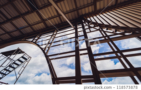 A structure featuring wooden slats on construction site contributing to its architectural style A structure featuring wooden slats on construction site contributing to its architectural style 118573878