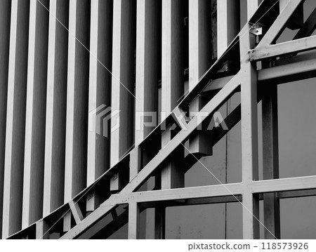 A structure featuring wooden slats on construction site contributing to its architectural style 118573926