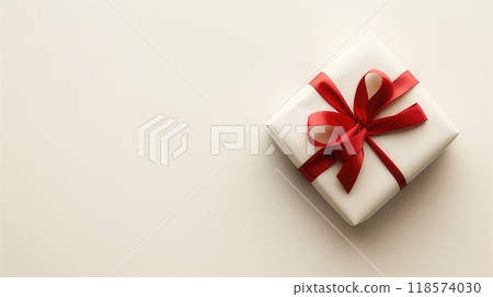 A white gift box with a red ribbon tied elegantly around it AI-generated content 118574030
