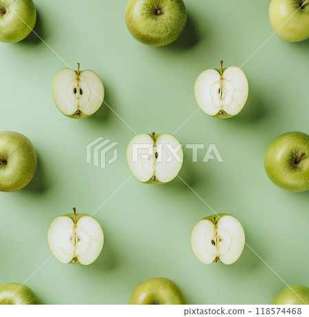 green apples pattern on pastel green background, copy space, apples cut in half, top view 118574468
