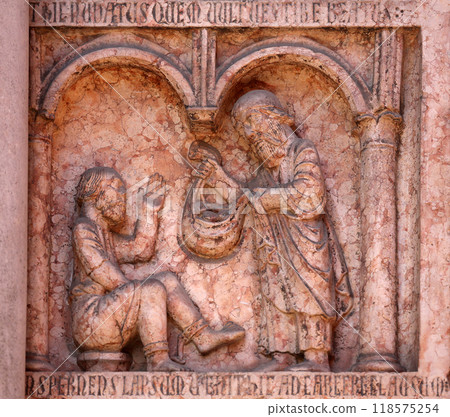 Christ Performing Works of Mercy relief at the baptistry from Benedetto Antelami, Parma, Emilia Romagna, Italy 118575254