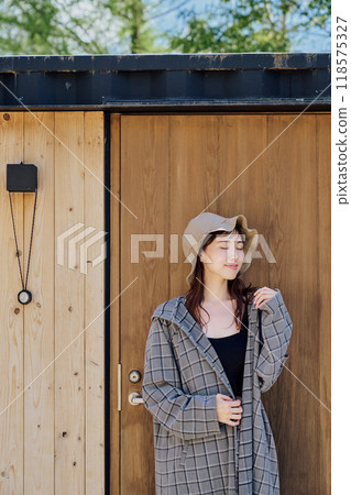 A woman wearing a sauna hat and sauna wear 118575327