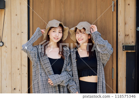 A woman wearing a sauna hat and sauna wear 118575346