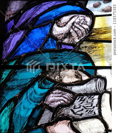 God begins salvation in this world through His Son Jesus Christ, detail of stained glass window by Sieger Koder in St. John church in Piflas, Germany 118575383