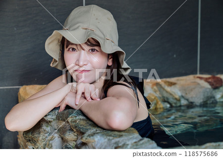 Female taking a water bath 118575686