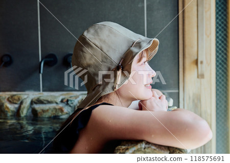 Female taking a water bath 118575691