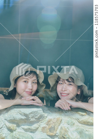 Female taking a water bath 118575703